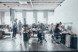 Team at work. Group of young business people in smart casual wear working together in creative office